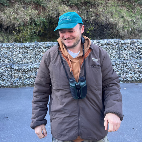Māori man looking down and smiling